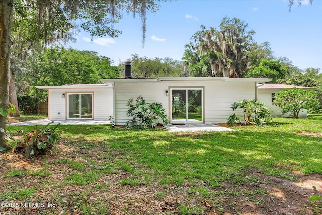 2453 Jetty Ct, Jacksonville, FL 32233 - back of property with a patio and a yard