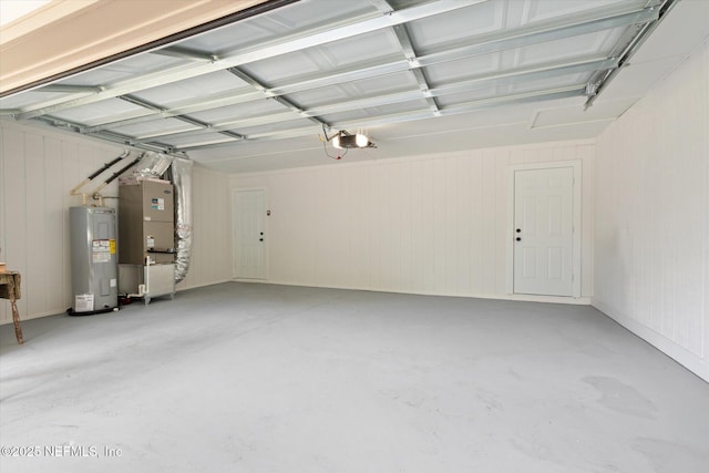 2453 Jetty Ct, Jacksonville, FL 32233 - garage featuring electric water heater, a garage door opener, and heating unit
