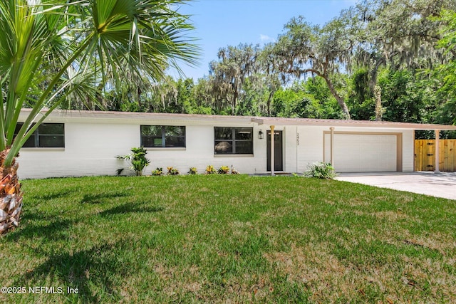 2453 Jetty Ct, Jacksonville, FL 32233 - view of front of house featuring concrete block siding, an attached garage, and driveway