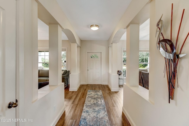644 Sun Down Cir, Saint Augustine, FL 32080 - foyer entrance with arched walkways and light wood-style flooring