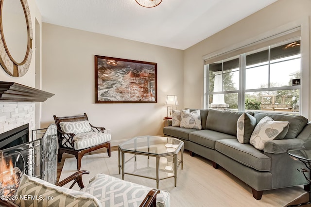 644 Sun Down Cir, Saint Augustine, FL 32080 - living area featuring a glass covered fireplace and light wood-style flooring