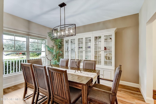 644 Sun Down Cir, Saint Augustine, FL 32080 - dining room featuring a chandelier, plenty of natural light, and light wood-type flooring