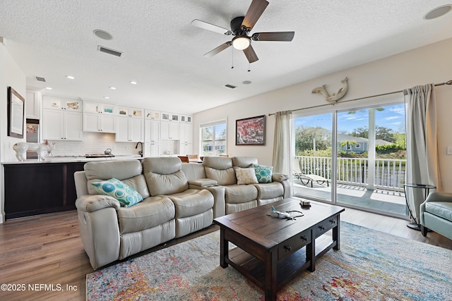 644 Sun Down Cir, Saint Augustine, FL 32080 - living area featuring wood finished floors, a textured ceiling, ceiling fan, and recessed lighting