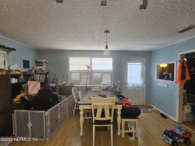 105 Owens Acres Dr, Macclenny, FL 32063 - dining space featuring wood finished floors and a textured ceiling