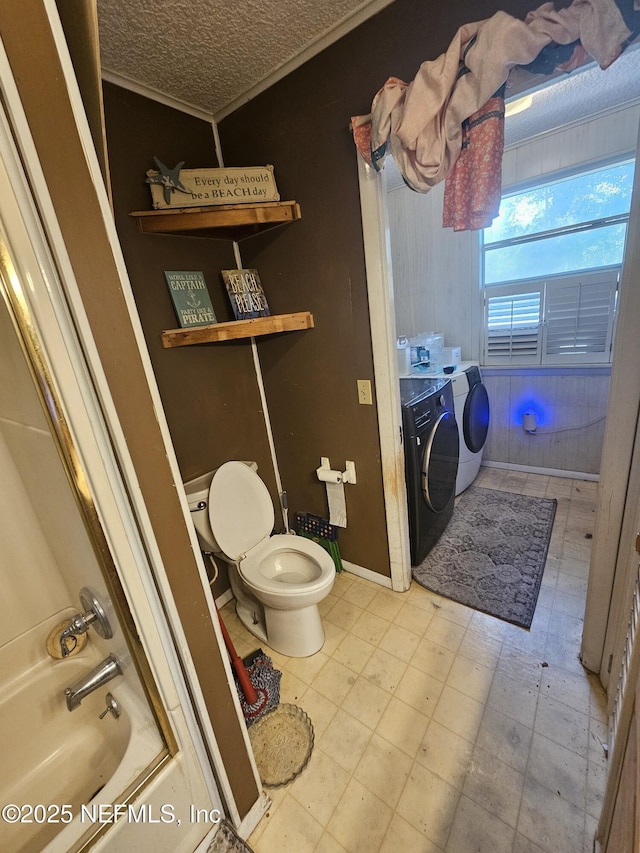 105 Owens Acres Dr, Macclenny, FL 32063 - bathroom featuring washer and clothes dryer, bathing tub / shower combination, and ornamental molding