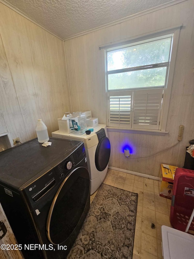 105 Owens Acres Dr, Macclenny, FL 32063 - washroom with washer and dryer, a textured ceiling, and wooden walls