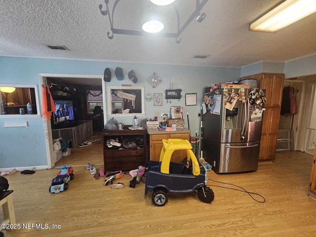 105 Owens Acres Dr, Macclenny, FL 32063 - miscellaneous room featuring light wood-style flooring and a textured ceiling
