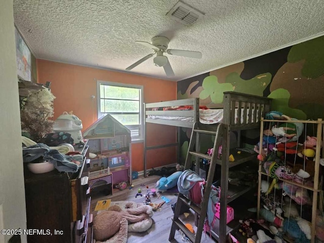 105 Owens Acres Dr, Macclenny, FL 32063 - bedroom with a textured ceiling, wood finished floors, and a ceiling fan