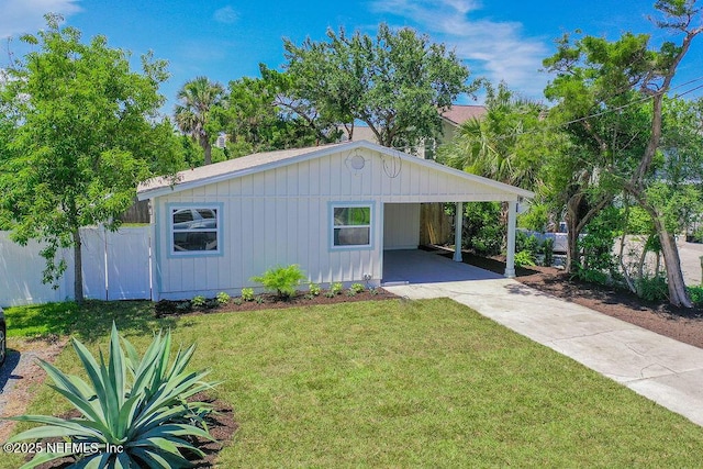 407 Lower 8th Ave S, Jacksonville Beach, FL 32250 - view of front of home with driveway and an attached carport