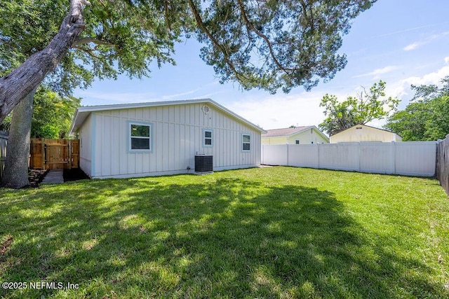 407 Lower 8th Ave S, Jacksonville Beach, FL 32250 - back of house featuring board and batten siding and a fenced backyard