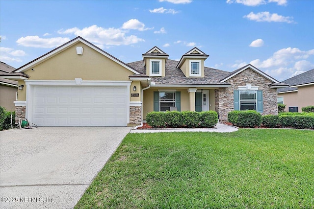 3504 Garibaldi Way, Saint Augustine, FL 32092 - view of front facade featuring stone siding, stucco siding, a front yard, concrete driveway, and a garage