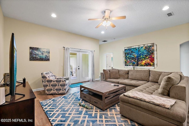 3504 Garibaldi Way, Saint Augustine, FL 32092 - living area featuring ceiling fan, recessed lighting, arched walkways, wood finished floors, and french doors