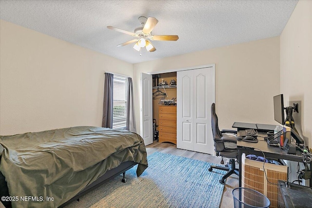 3504 Garibaldi Way, Saint Augustine, FL 32092 - bedroom with wood finished floors, a desk, a closet, a textured ceiling, and ceiling fan