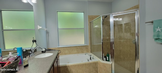308 Winding Oak Way, Saint Augustine, FL 32084 - bathroom featuring vanity, a jetted tub, and a stall shower