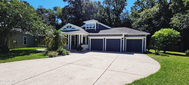 308 Winding Oak Way, Saint Augustine, FL 32084 - view of front facade with a front lawn, a garage, and driveway