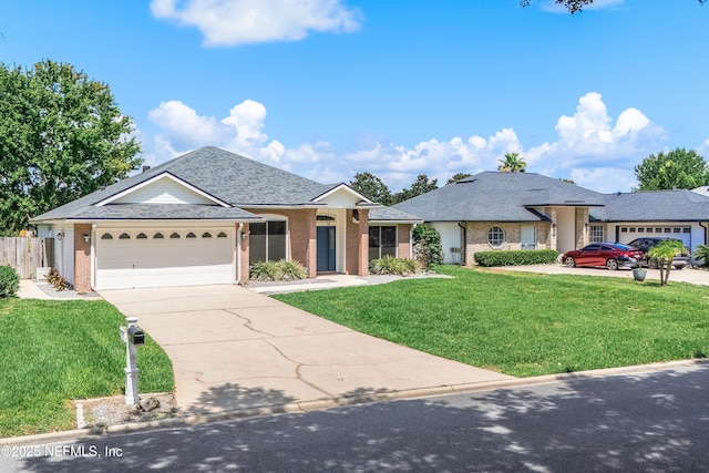 429 N Bridgestone Ave, Saint Johns, FL 32259 - single story home with an attached garage, brick siding, concrete driveway, and roof with shingles