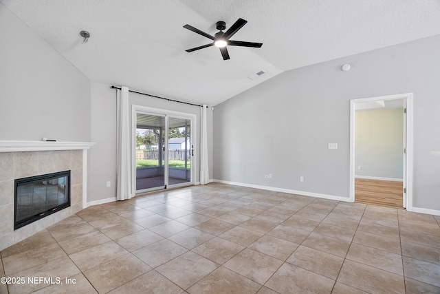 429 N Bridgestone Ave, Saint Johns, FL 32259 - unfurnished living room featuring vaulted ceiling, a ceiling fan, tile patterned floors, and a tile fireplace