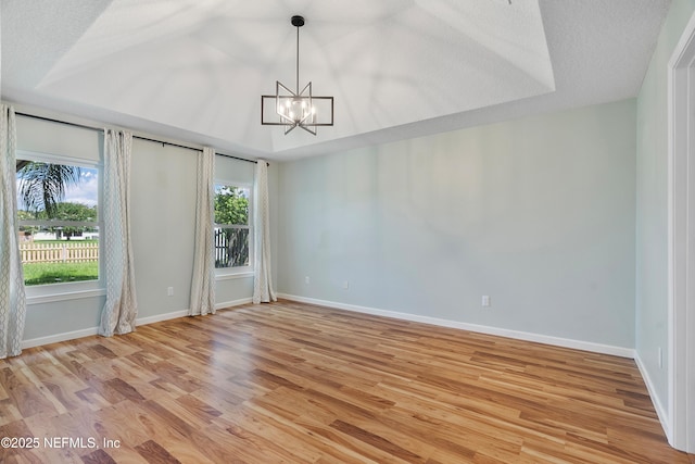 429 N Bridgestone Ave, Saint Johns, FL 32259 - empty room with a chandelier and light wood-style flooring