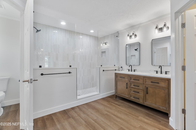 429 N Bridgestone Ave, Saint Johns, FL 32259 - bathroom with double vanity, a walk in shower, wood finished floors, and recessed lighting