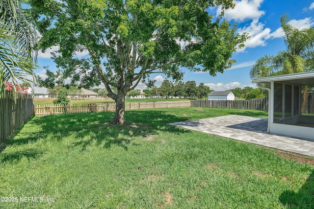 429 N Bridgestone Ave, Saint Johns, FL 32259 - fenced backyard featuring a sunroom and a patio area