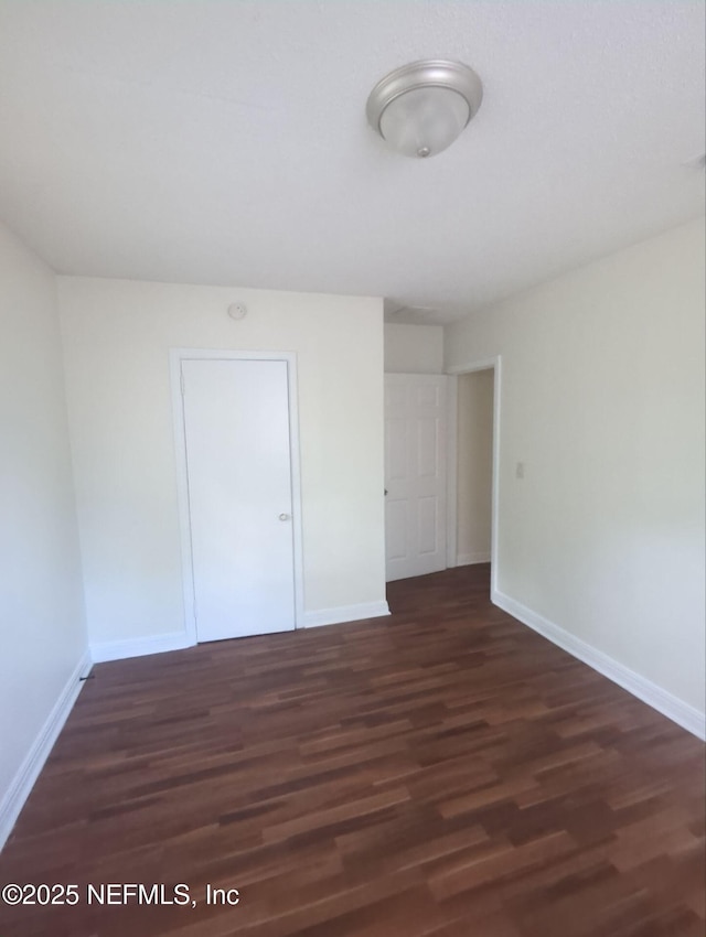3136 Post St, Jacksonville, FL 32205 - unfurnished bedroom featuring baseboards and wood finished floors