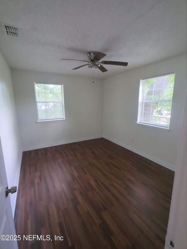 3136 Post St, Jacksonville, FL 32205 - unfurnished room with plenty of natural light, wood finished floors, a textured ceiling, and ceiling fan