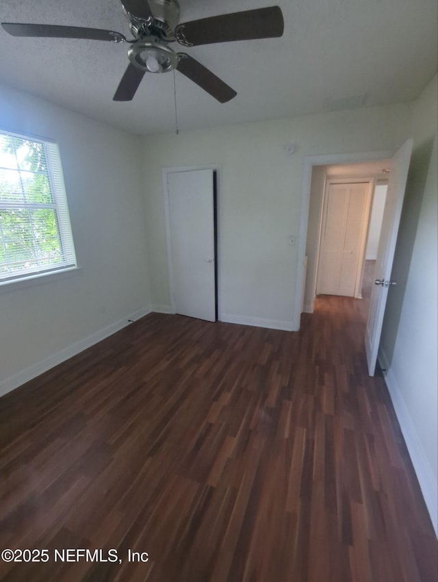 3136 Post St, Jacksonville, FL 32205 - unfurnished bedroom featuring dark wood finished floors, ceiling fan, and a closet