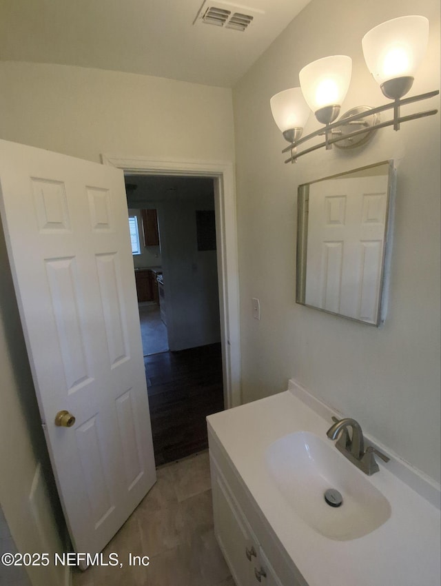 3136 Post St, Jacksonville, FL 32205 - bathroom featuring a chandelier and vanity