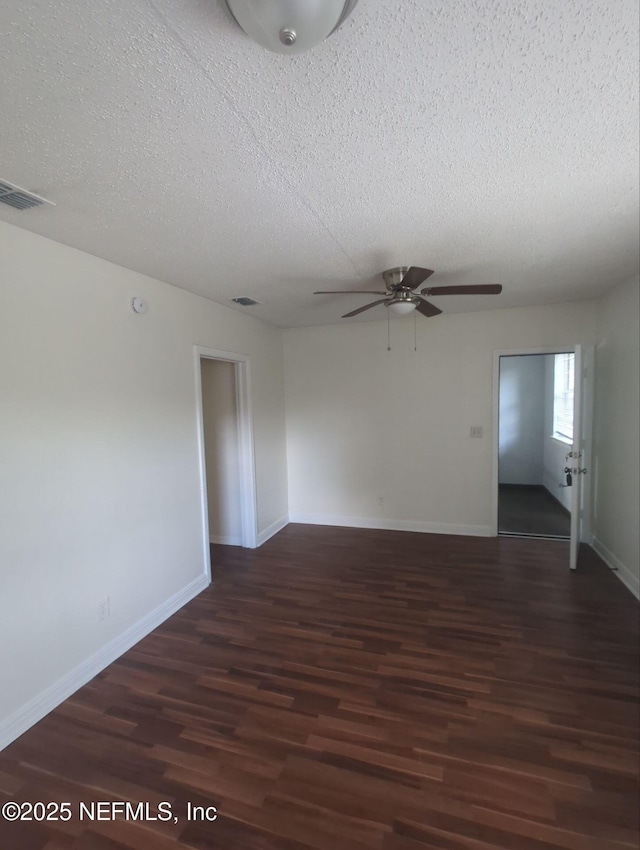3136 Post St, Jacksonville, FL 32205 - spare room featuring wood finished floors, a ceiling fan, and a textured ceiling