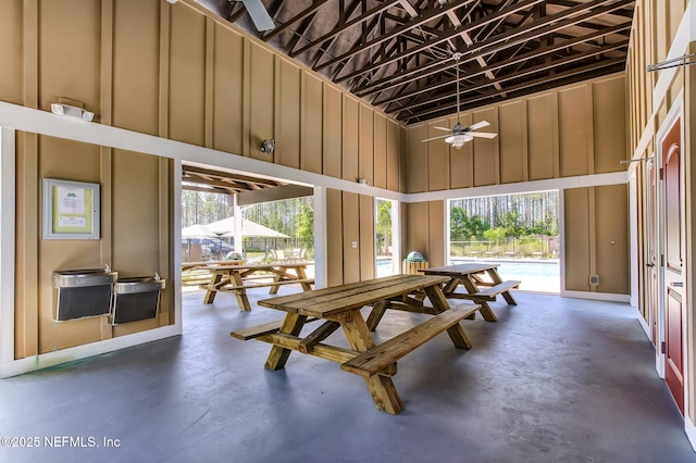 78262 Saddle Rock Rd, Yulee, FL 32097 - dining room with concrete flooring, ceiling fan, and a towering ceiling