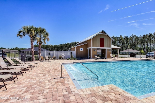 78262 Saddle Rock Rd, Yulee, FL 32097 - community pool featuring a patio