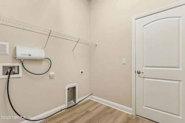 78262 Saddle Rock Rd, Yulee, FL 32097 - washroom featuring light wood-type flooring, washer hookup, and electric dryer hookup