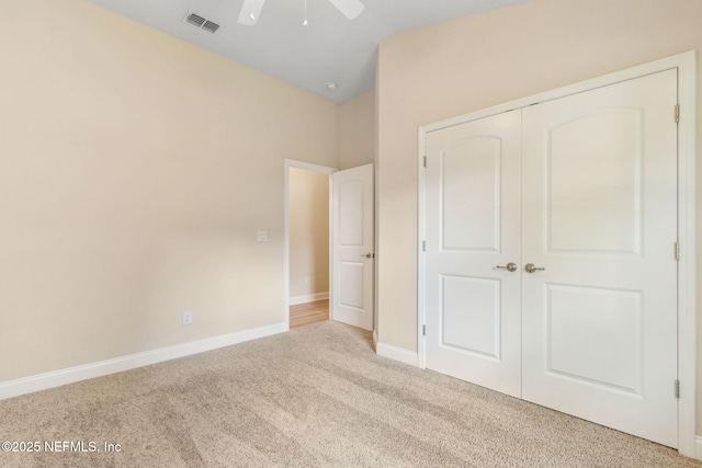 78262 Saddle Rock Rd, Yulee, FL 32097 - unfurnished bedroom featuring carpet floors, a closet, vaulted ceiling, and ceiling fan