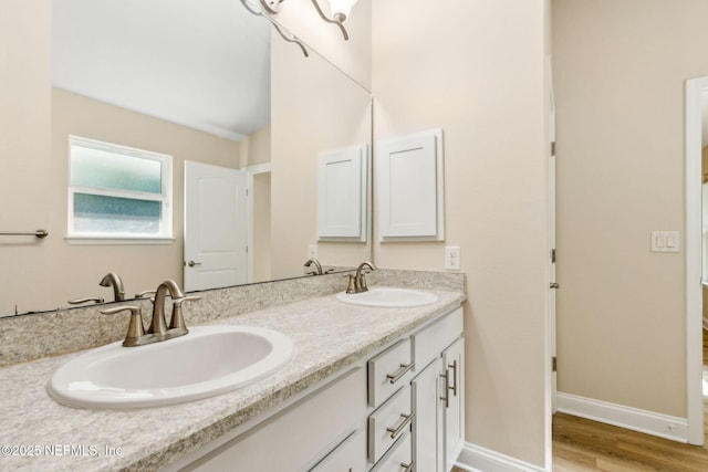 78262 Saddle Rock Rd, Yulee, FL 32097 - full bathroom featuring double vanity and wood finished floors