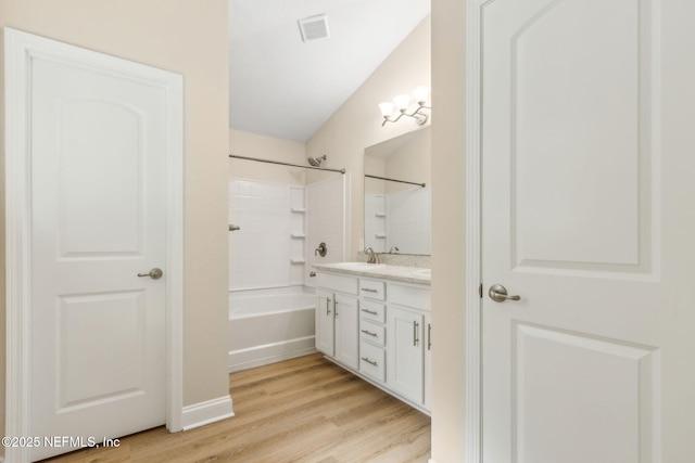78262 Saddle Rock Rd, Yulee, FL 32097 - full bath featuring vanity, wood finished floors, and shower / bathtub combination