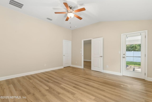 78262 Saddle Rock Rd, Yulee, FL 32097 - unfurnished bedroom with access to exterior, light wood finished floors, vaulted ceiling, and a ceiling fan