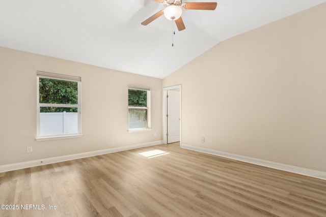 78262 Saddle Rock Rd, Yulee, FL 32097 - spare room with vaulted ceiling, healthy amount of natural light, light wood-type flooring, and ceiling fan