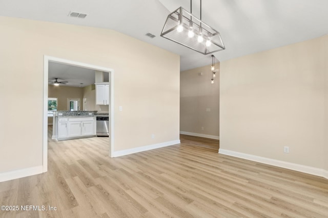 78262 Saddle Rock Rd, Yulee, FL 32097 - empty room with light wood-style floors, a ceiling fan, and vaulted ceiling