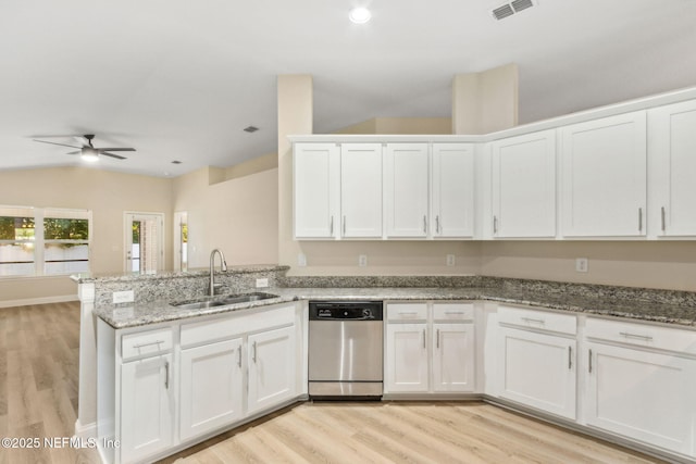 78262 Saddle Rock Rd, Yulee, FL 32097 - kitchen featuring dishwasher, a ceiling fan, a peninsula, white cabinetry, and vaulted ceiling