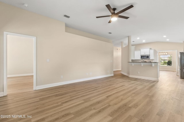 78262 Saddle Rock Rd, Yulee, FL 32097 - unfurnished living room featuring ceiling fan, light wood-type flooring, recessed lighting, and vaulted ceiling