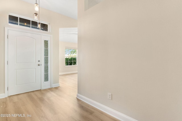 78262 Saddle Rock Rd, Yulee, FL 32097 - entryway featuring light wood finished floors and baseboards