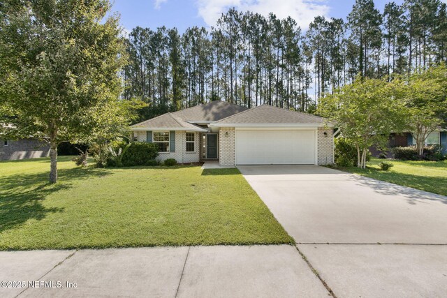 78262 Saddle Rock Rd, Yulee, FL 32097 - ranch-style home with an attached garage, driveway, a front lawn, and brick siding