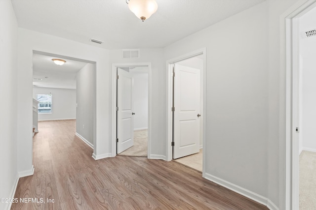 82 Birchfield Ln, Saint Augustine, FL 32092 - corridor featuring light wood finished floors and baseboards