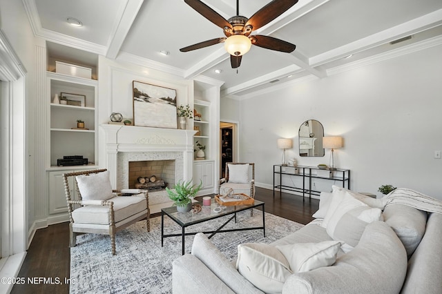 8483 Stables Rd, Jacksonville, FL 32256 - living area with a ceiling fan, beamed ceiling, built in shelves, dark wood-type flooring, and ornamental molding