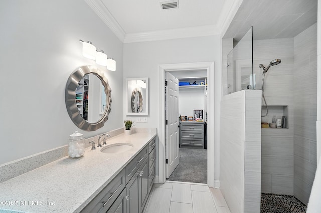 8483 Stables Rd, Jacksonville, FL 32256 - bathroom featuring ornamental molding, vanity, walk in shower, and a spacious closet