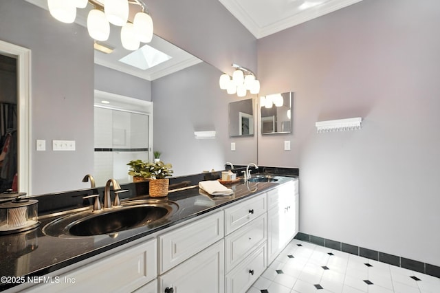 8483 Stables Rd, Jacksonville, FL 32256 - bathroom featuring crown molding, double vanity, a skylight, a stall shower, and tile patterned floors