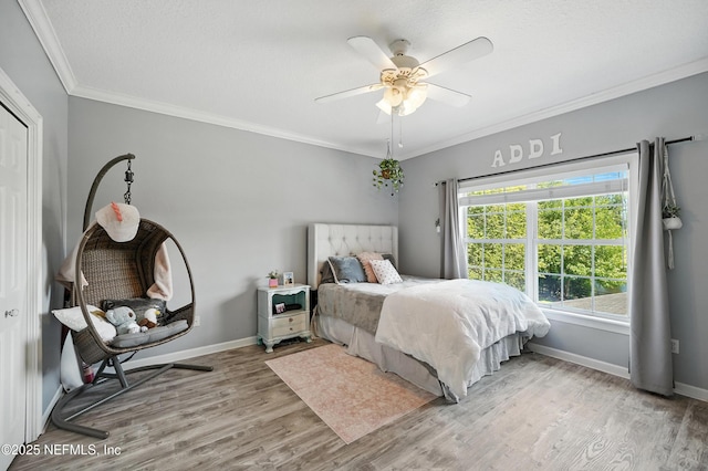 8483 Stables Rd, Jacksonville, FL 32256 - bedroom featuring light wood-style flooring, crown molding, and a ceiling fan