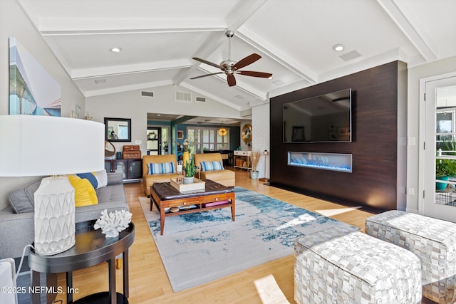 1786 Selva Marina Dr, Atlantic Beach, FL 32233 - living area featuring healthy amount of natural light, light wood finished floors, ceiling fan, and a glass covered fireplace