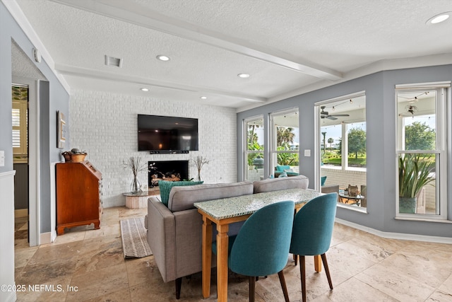 1786 Selva Marina Dr, Atlantic Beach, FL 32233 - living room with a textured ceiling, a brick fireplace, an accent wall, recessed lighting, and beam ceiling