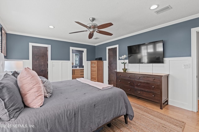 1786 Selva Marina Dr, Atlantic Beach, FL 32233 - bedroom with wood finished floors, a wainscoted wall, ornamental molding, a textured ceiling, and a ceiling fan